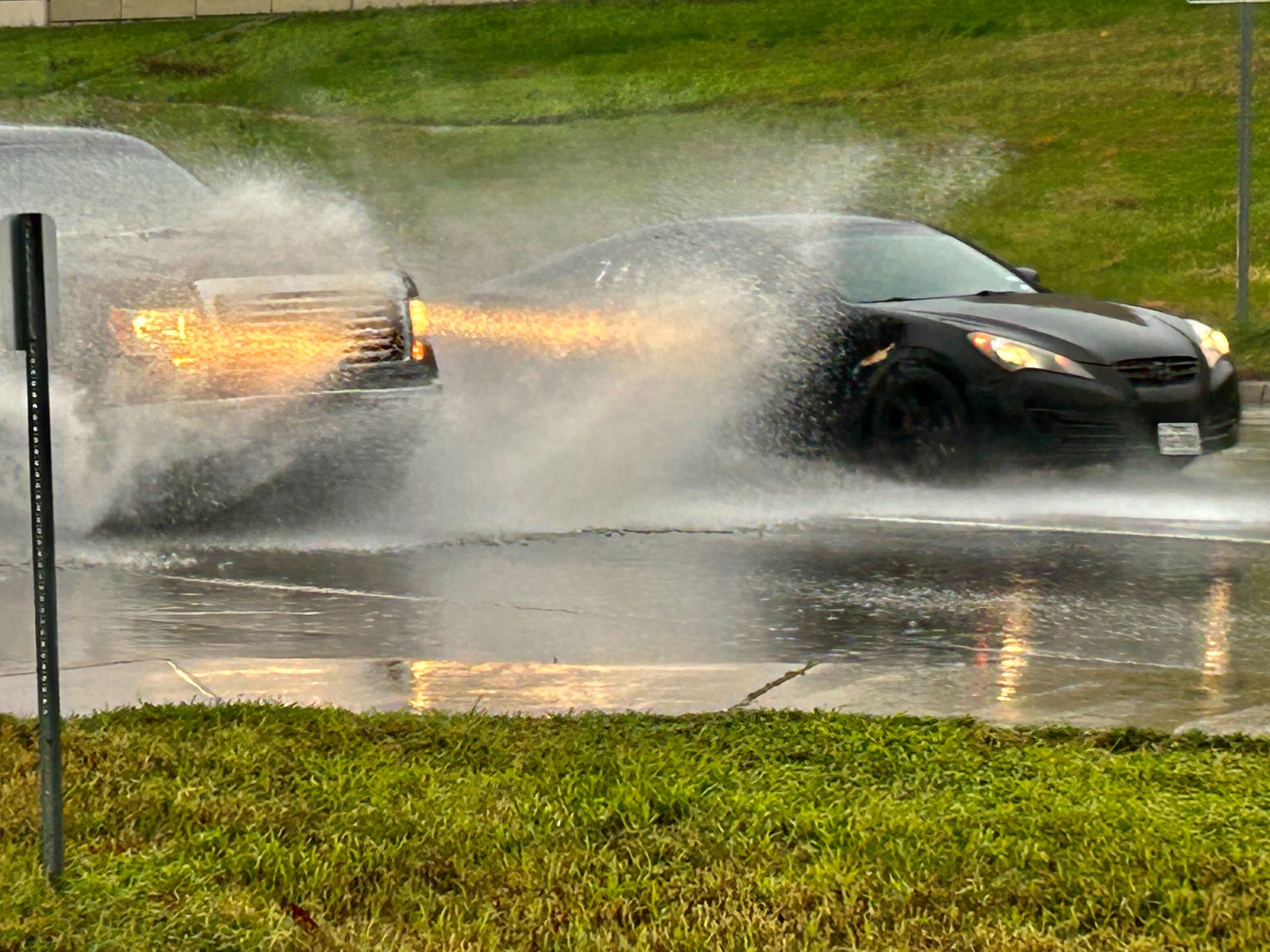 Cars driving on the U.S. Highway 290 frontage road on a rainy day in Austin. (KXAN Photo/Frank Martinez)